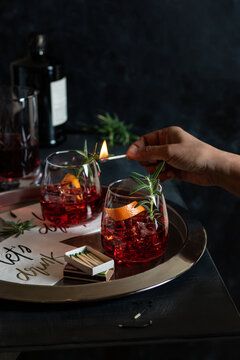 Classic Negroni cocktail with smoked rosemary garnish