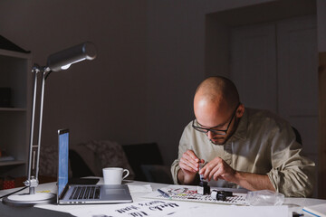 Artist preparing materials for order
