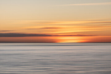 Blurred coastal sunset