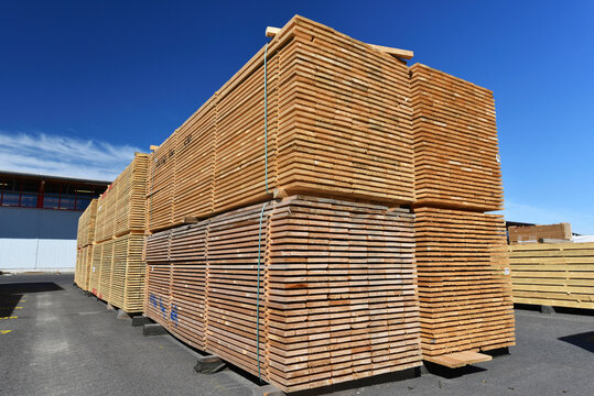 Planks stacked in lumberyard