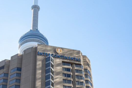 Toronto, Canada - October 28, 2020: Intercontinental Hotel Sign Is Seen With CN Tower In Background In Toronto. InterContinental Hotels Group Plc Is A British Multinational Hospitality Company. 