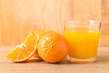 Fresh Honey Murcott orange fruit and juice on wooden background, Healthy drink