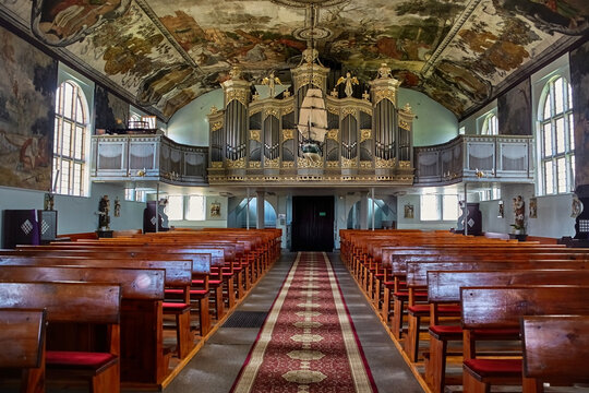 Church of Sacred Heart of Jesus in Stegna interior view towards the organ and ship model hanging from the ceiling, Poland