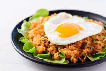 Kimchi fried rice with fried egg on top, Korean food, Close up
