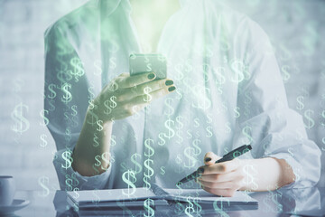 Fototapeta premium Double exposure of forex chart sketch hologram and woman holding and using a mobile device. Financial market concept.