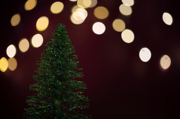 Christmas tree with blurred lights in the background. 