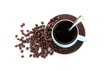 Looking down on a cup of coffee and scattered coffee beans on white background