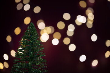 Fototapeta na wymiar Christmas tree with blurred lights in the background. 