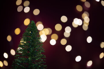 Fototapeta na wymiar Christmas tree with blurred lights in the background. 