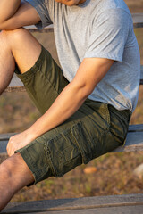 Asia man in bermuda shorts and t-shirt, outdoor activity concept