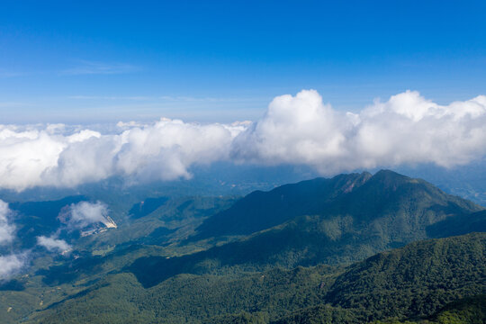 Aerial photography of blue sky and white clouds on the mountain