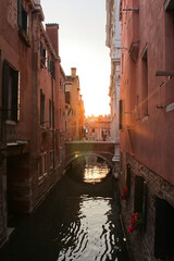 Obraz na płótnie Canvas Sunset over canal bridge, Venice, Italy. no people