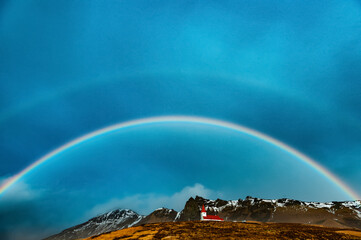 Closeup of rainbow scenery on snowy mountains in Iceland 