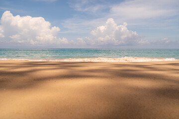 Fototapeta premium Tropical nature clean beach and white sand in summer with sun light blue sky and bokeh background.