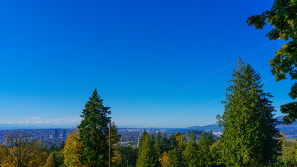 Panoramic Fall view from popular BC public park aon a bright autumn day
