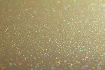 Full frame macro abstract background of sparkling beige white color glitter texture, with bokeh and copy space