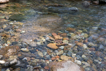 The flowing water pond stream in the outdoor mountain