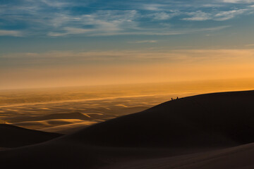 Climbers Watching Sunset on The Dune Field of Great Sand Dunes National Park, Colorado, USA