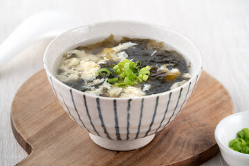 Taiwanese food - Homemade delicious seaweed egg drop soup in a bowl on a serving tray.