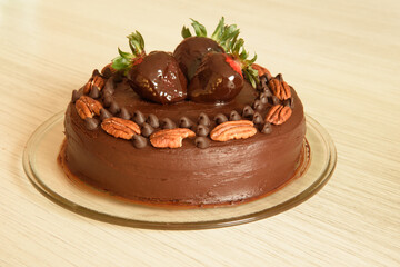 
chocolate cake and strawberries on top