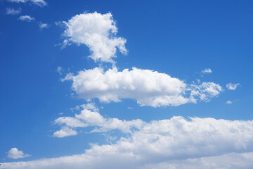 Naklejka na ściany i meble Blue sky and white clouds in the sky on a sunny day