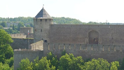 A waving flag of Russia on the Ivangorod castle across the border in Narva Estonia 