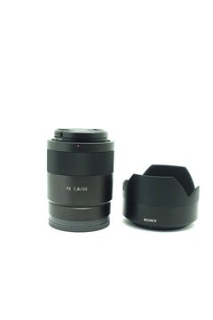 Zeiss 55mm f/1.8 lens against isolated white background