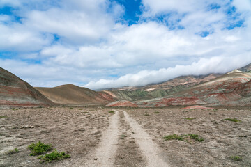 Fototapeta na wymiar Dirt road in beautiful red mountains