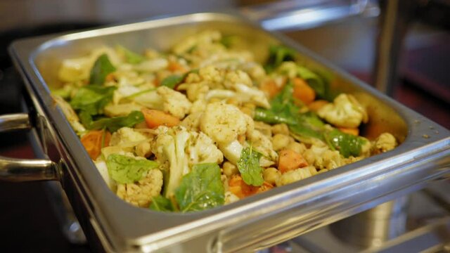 from the fire to the oven to the container of buffet vegetables