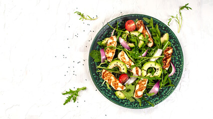 grilled Halloumi cheese with salad fresh tomatoes and avocado. Healthy food, diet lunch concept. diet menu. Keto Paleo diet menu. Top view, overhead, banner