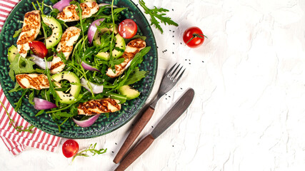 grilled Halloumi cheese with salad fresh tomatoes and avocado. Healthy food, diet lunch concept. diet menu. Keto Paleo diet menu. Top view, overhead, banner