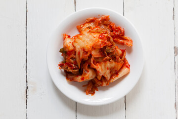 Korean traditional food called 'Kimchi or Kimchee' on white background. Close-up, open space