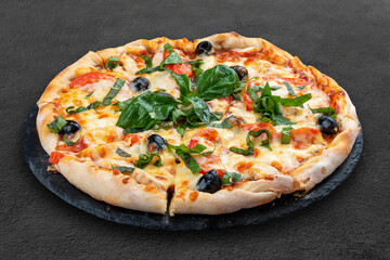 Pizza with salami and basturma, onions and basil