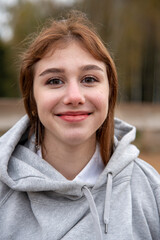 Portrait of a smiling teenage girl looking at the camera.