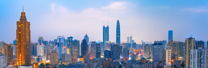Fototapeta na wymiar Skyline scenery of high-rise buildings at night in Luohu District, Shenzhen, China