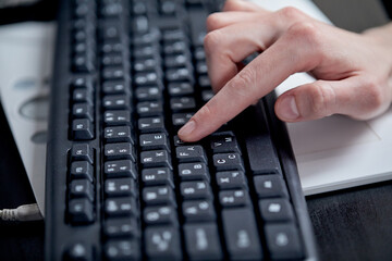 Female hands or woman office worker typing on the keyboard