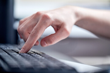 Obraz premium Female hands or woman office worker typing on the keyboard