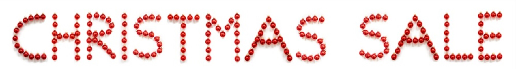 Red Christmas Ball Ornament Building English Word Christmas Sale. Festive Christmas Decoration. White Isolated Background