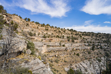 Fototapeta na wymiar Sunny view of the cliff home in Walnut Canyon National Monument