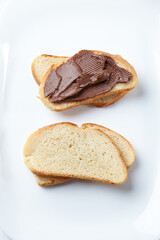 toast with chocolate pasta on white