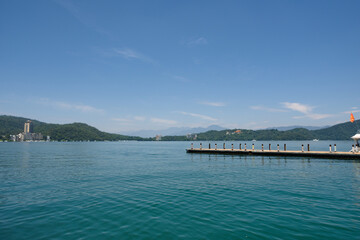 The pier at Sun moon lake, Nantou, Taiwan. Against mountains and blue sky.