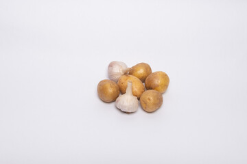 Set of vegetables. Raw potatoes, garlic.