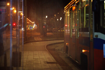 Naklejka na ściany i meble Empty bus late in the evening. View from the bus window.