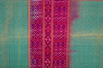 More than 100 years old colorful thai handcraft peruvian style rug surface old vintage torn conservation Made from natural materials Chemical free close up.