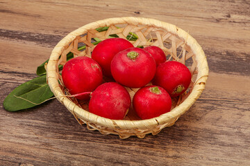 Ripe fresh radish heap over wooden