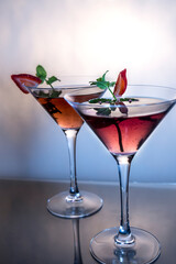 Strawberry Martini cocktails with smooth blue & gray background