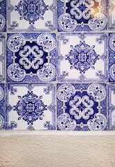 Background and Pattern : Azulejos vintage geometric portuguese and spanish ceramic tile work decoration with concrete wall. Seamless patchwork tile in the old town.