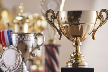 Fototapeta selective focus on one trophy with other trophies as background obraz