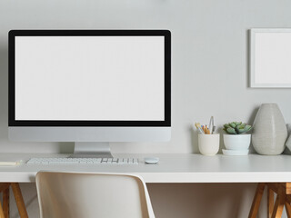 Close-up view of mock up desktop computer with office supplies and decoration