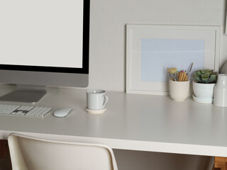Home office with computer, coffee mug, decorations and copy space on table, clipping path